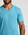 Man wearing Dark Heather Harbor Classic V-Neck, showcasing tattoos.