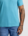 Dark Heather Harbor Classic V-Neck on model, showing fit and tattoos.