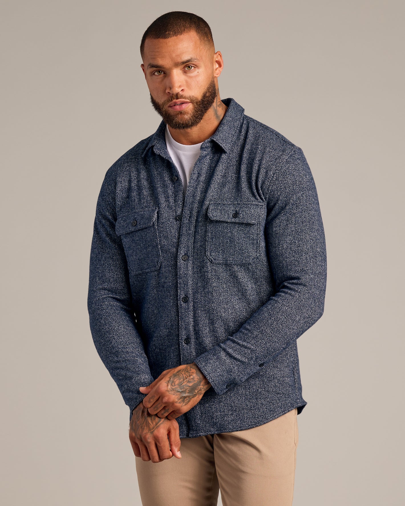 Navy Sweater Shirt Jacket with herringbone pattern, worn over white tee.