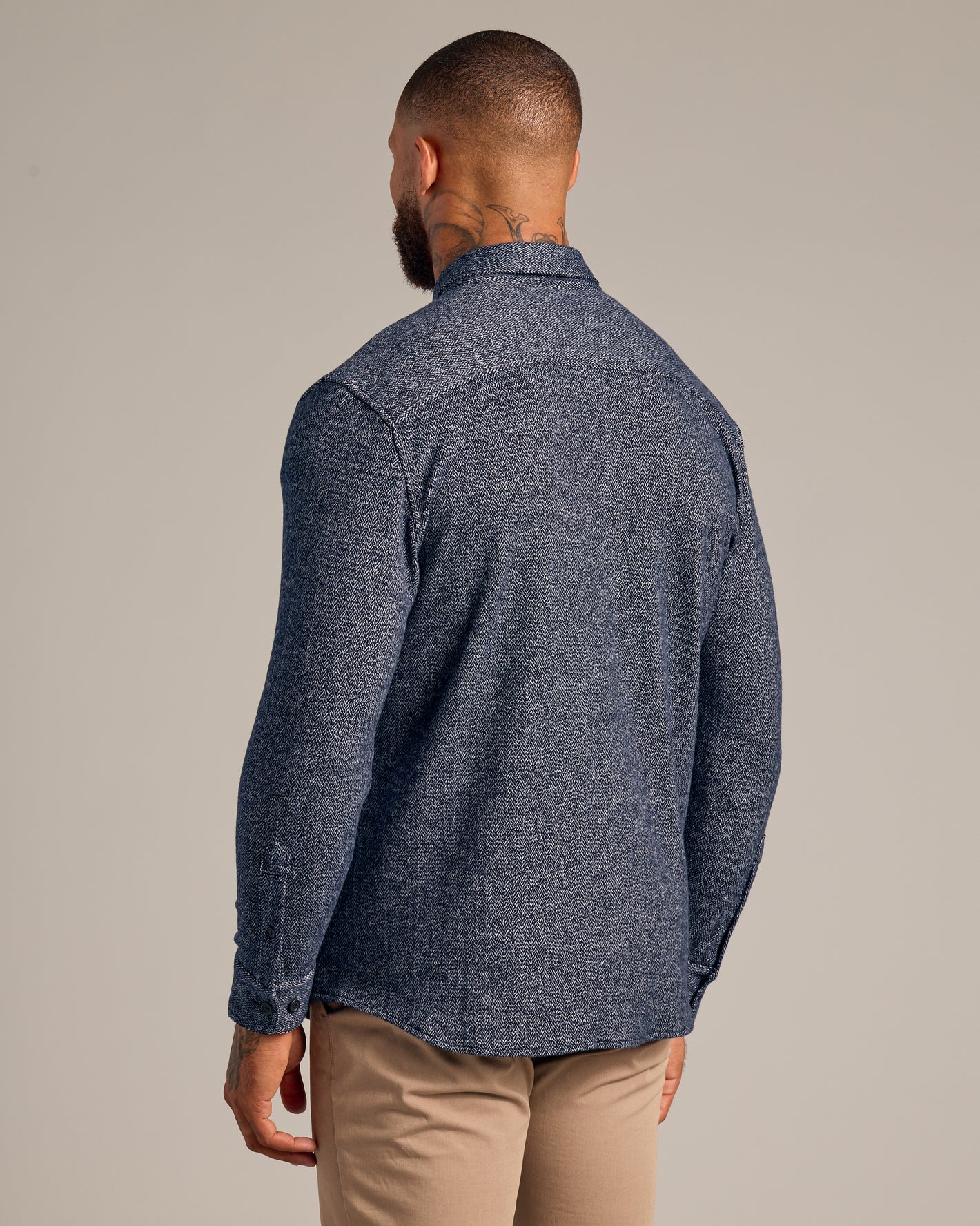Model in Navy Sweater Shirt Jacket, showcasing herringbone texture and slim fit.