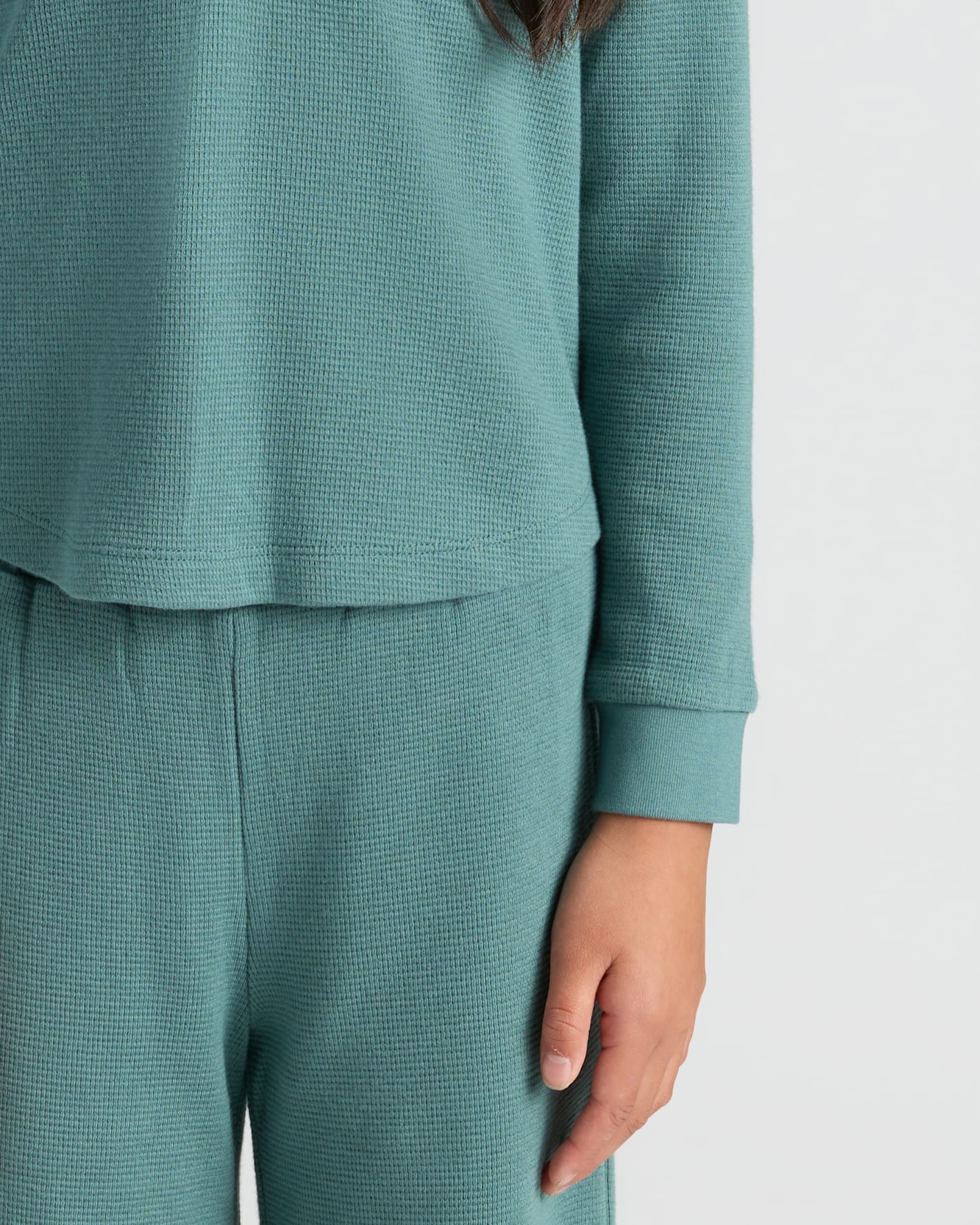 Girls Stormcloud Long Sleeve Boxy Waffle Henley, showing thermal texture and cuffed sleeves.