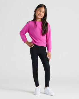 Girl in bright pink pullover from Girls Stormcloud & Electric Fuchsia Slouch Pullover Crew 2-Pack.