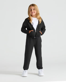 Child in black hoodie and Girls Deep Emerald & Black Relaxed Joggers.