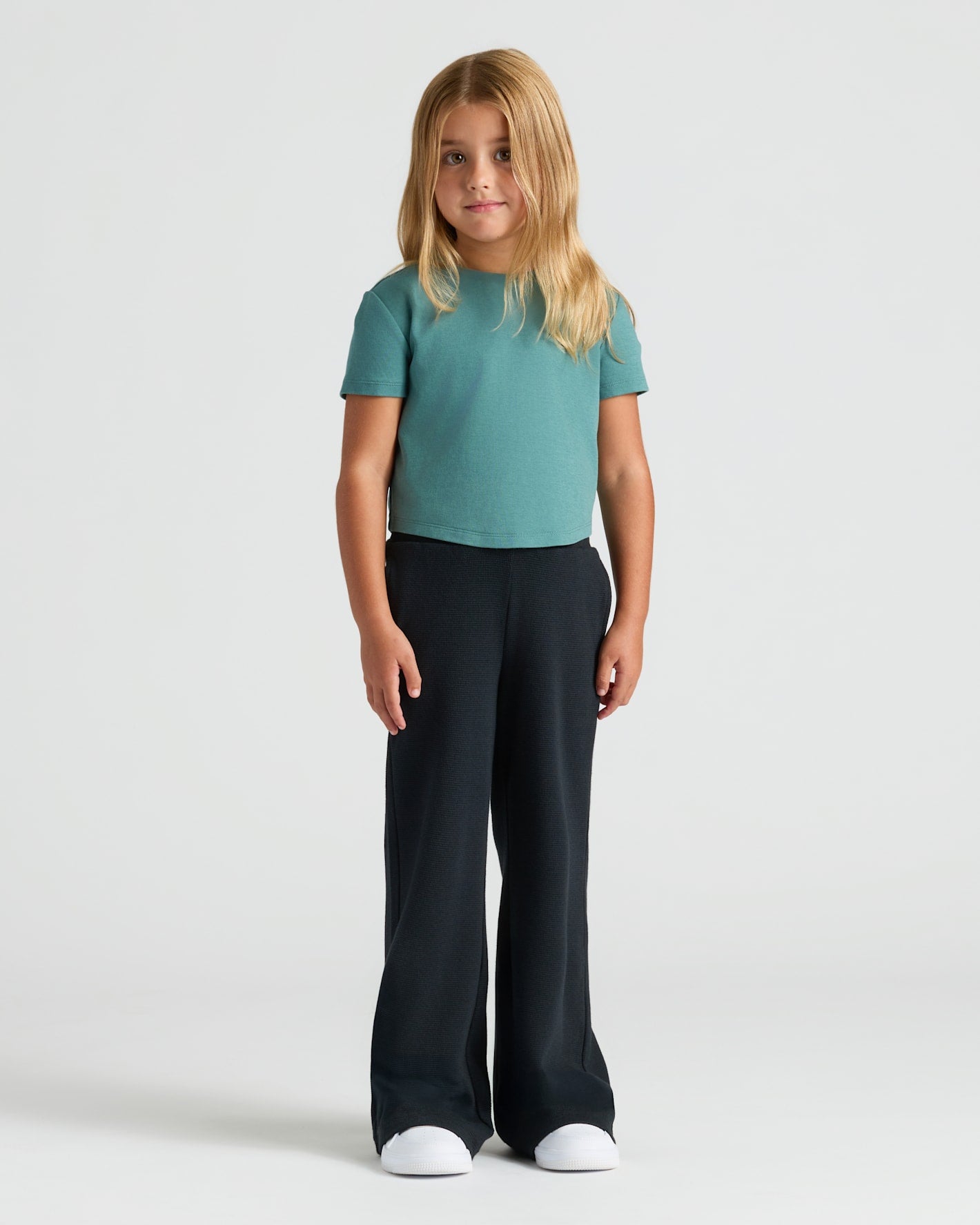 Girl wearing Girls Waffle Wide Leg Pants 3-Pack, relaxed pose, neutral expression.