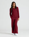 Girl in burgundy Girls Waffle Wide Leg Pants, comfy fit, hands in pockets.