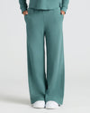 Girls Stormcloud Waffle Wide Leg Pants with pockets and white sneakers.