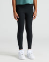 Girls All Black Foldover Legging worn with sneakers.