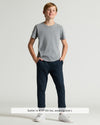 Boy wearing Boys' Heather Gray Classic Curved Hem Crew Neck with navy joggers.
