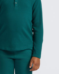 True ClassicBoys' Waffle Long Sleeve Henley 6-Pack in teal-green, worn casually.