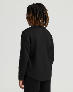 True ClassicBoys' All Black Waffle Long Sleeve Henley worn by model.