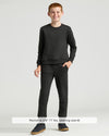 Boy in Boys' Black Fleece Jogger, smiling, with matching sweatshirt and sneakers.