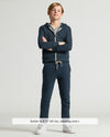 Boy wearing Boys' Navy Fleece Jogger, navy hoodie, gray T-shirt, white sneakers.