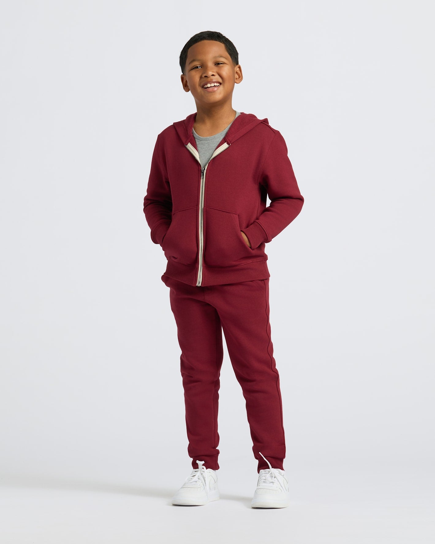 Boys' Dark Maroon Fleece Full Zip Hoodie with joggers and sneakers.
