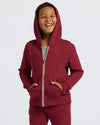 Boys' Dark Maroon Fleece Full Zip Hoodie worn by a smiling boy.