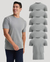 A smiling man wearing a light gray short-sleeve crewneck t-shirt, shown next to a vertical stack of seven identical t-shirts on a light gray background.