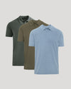 Three short-sleeve polo shirts in different colors are displayed in a staggered stack on a light gray background. The front shirt is light blue, the middle shirt is olive brown, and the back shirt is dark green.
