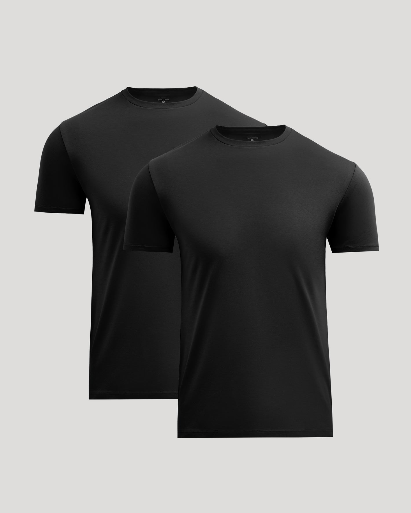 Two plain black crew neck t-shirts in a pack, showcasing the All Black Pima Cotton Blend Crew 2-Pack men's basics with a smooth, comfortable fabric appearance.
