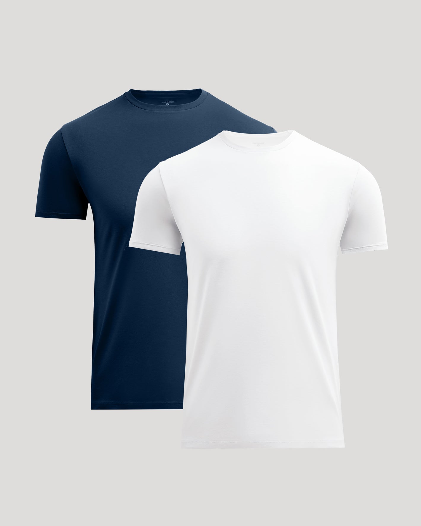 Two men's crew neck t-shirts in navy and white shown together, highlighting the Pima Cotton Blend Crew 2-Pack as comfortable and essential basics.