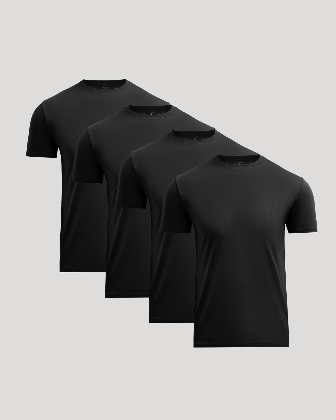 Four black crew neck t-shirts made from a pima cotton blend, shown as a set titled All Black Pima Cotton Blend Crew 4-Pack, perfect for men's basics.