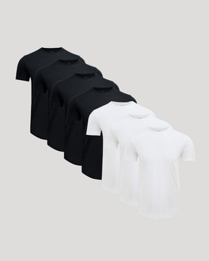 Seven men's Pima Cotton Blend Curved Hem Crew 7-Pack t-shirts in black and white, displayed in a staggered arrangement.