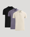 Three polo shirts in black, purple, and beige on a light gray background