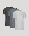 Three gray t-shirts in different shades on a light gray background