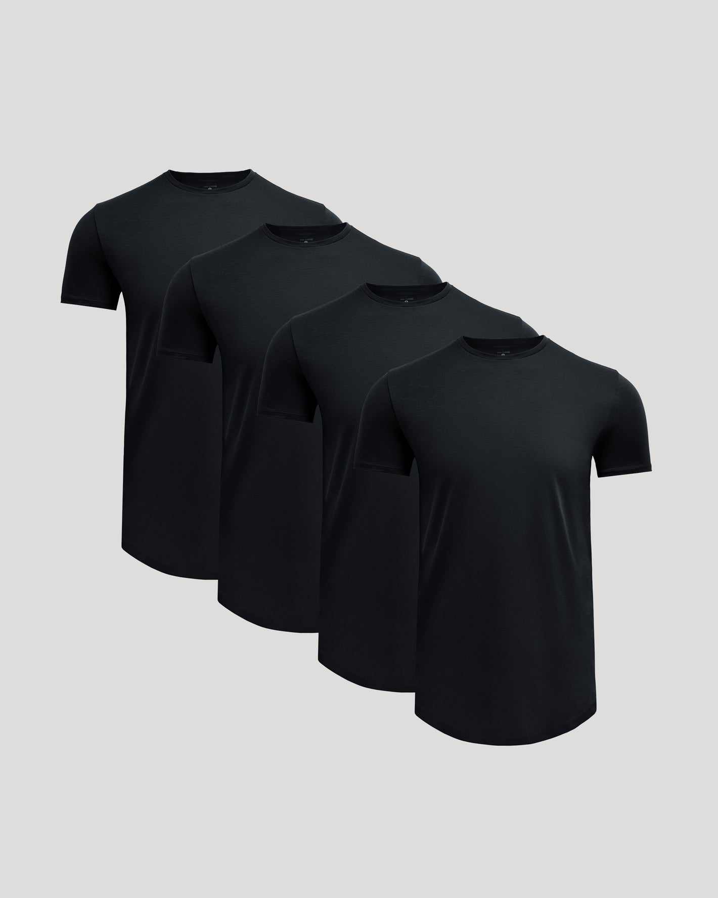 Four black crew neck t-shirts with a curved hem arranged in a staggered formation, representing the Tall Pima Cotton Blend Curved Hem Crew 4-Pack for men's basics.