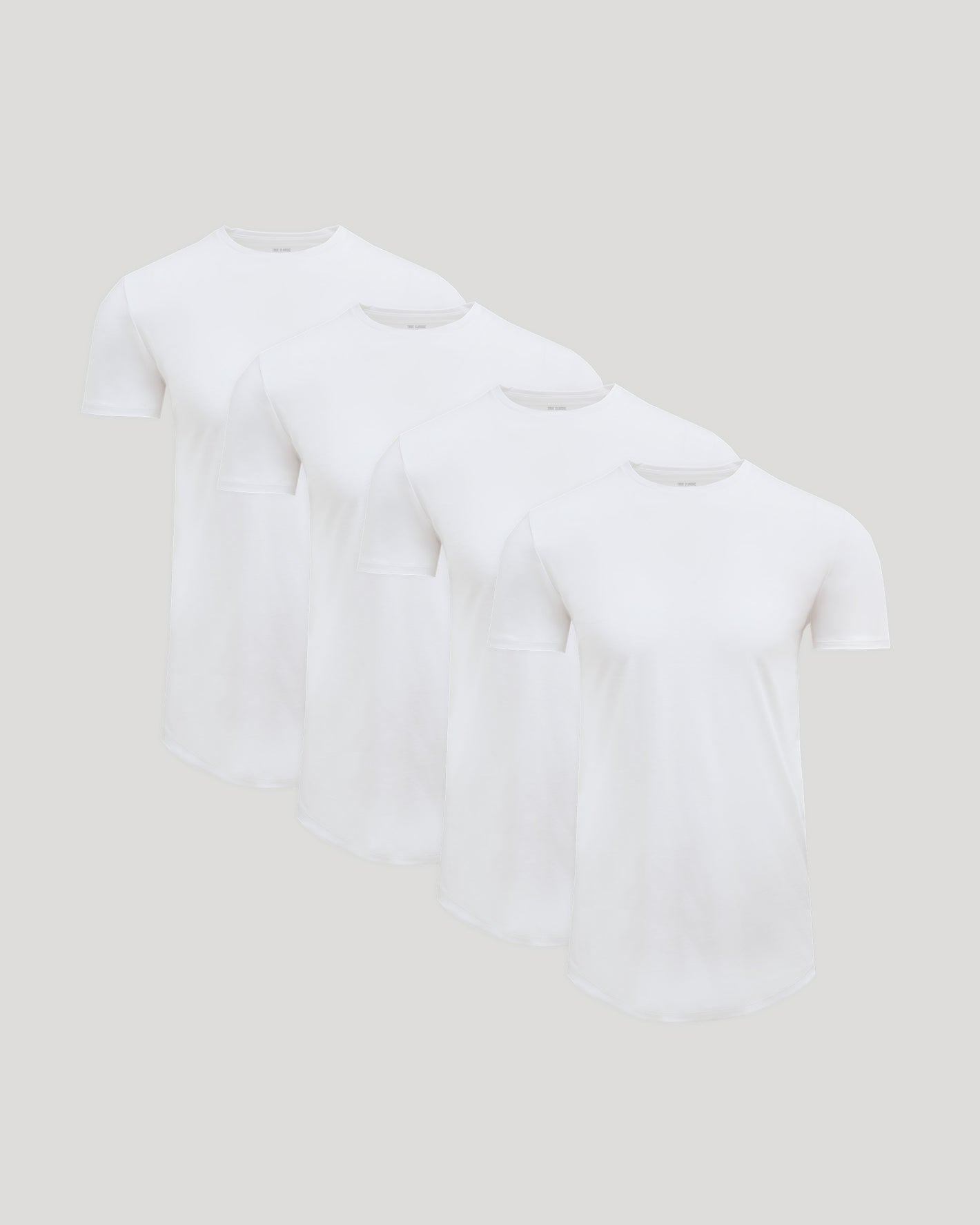 Four white crew neck t-shirts displayed in a row, representing the Tall Pima Cotton Blend Curved Hem Crew 4-Pack men's basics collection.
