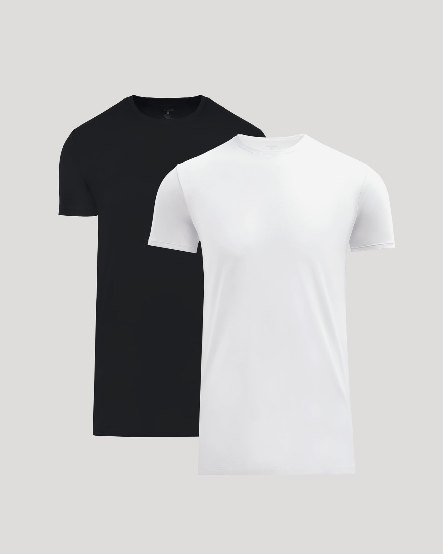 Two men's basic crew neck t-shirts in black and white, displayed side by side, showcasing the Tall Pima Cotton Blend Crew 2-Pack.