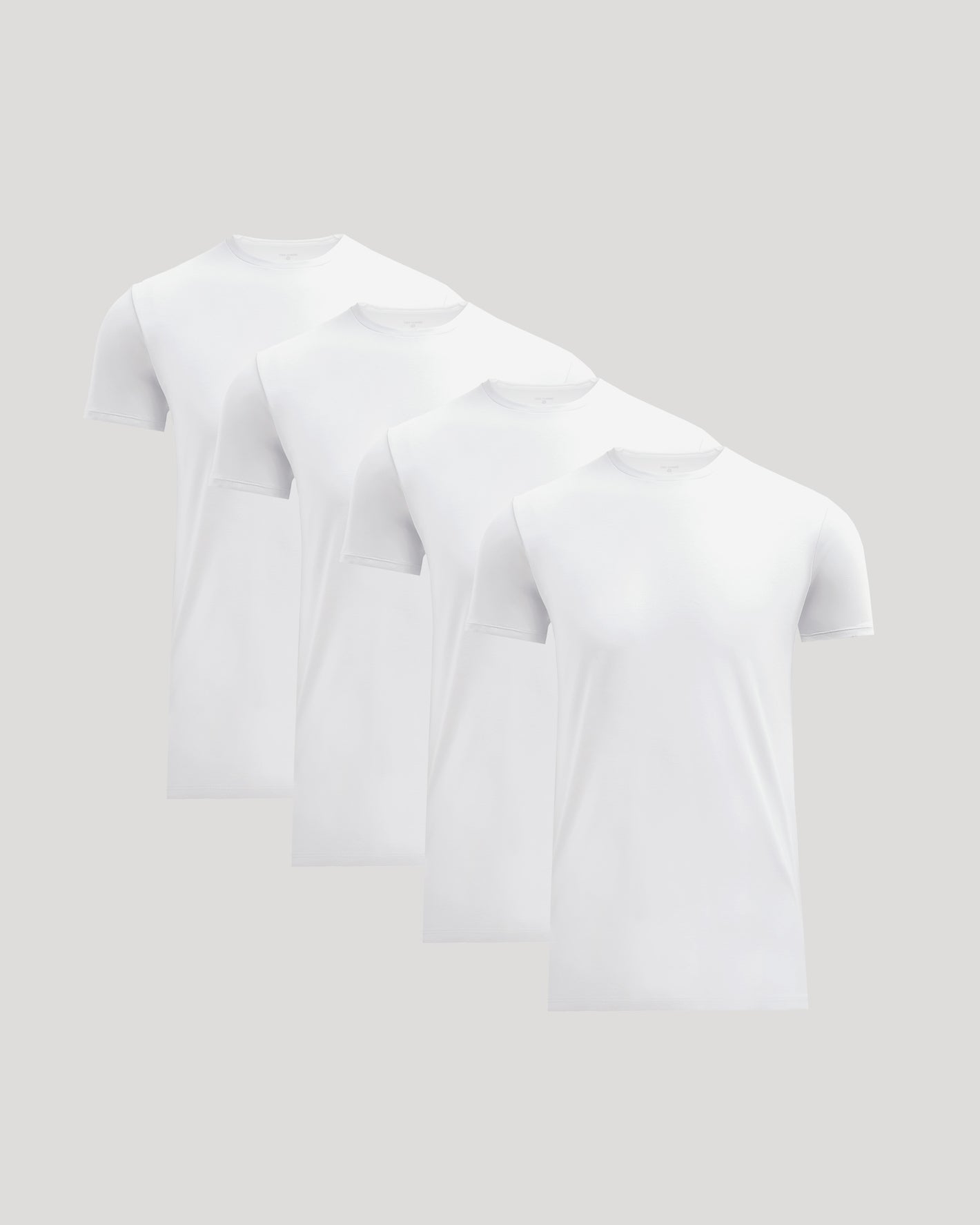 Four plain white crew neck t-shirts neatly arranged, showcasing the Tall Pima Cotton Blend Crew 4-Pack as essential men's basics.