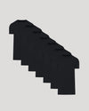 Seven black crew neck t-shirts arranged in a staggered row, showcasing the Tall Pima Cotton Blend Crew 7-Pack as essential men's basics.