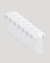 Seven white crew neck t-shirts neatly arranged in a staggered line, representing the Tall Pima Cotton Blend Crew 7-Pack men's basics collection.