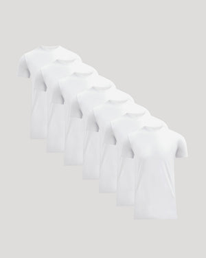 Seven white crew neck t-shirts neatly arranged in a staggered line, representing the Tall Pima Cotton Blend Crew 7-Pack men's basics collection.