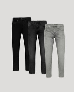 True ClassicThree pairs of jeans in black, dark gray, and light gray on a light gray background