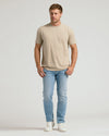 Man wearing Heather Fennel Classic Crew Neck t-shirt with jeans and sneakers.