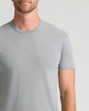 Man wearing Heather Gray Classic Crew Neck T-shirt.