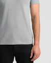 Heather Gray Classic Crew Neck T-shirt with black pants, right arm visible.