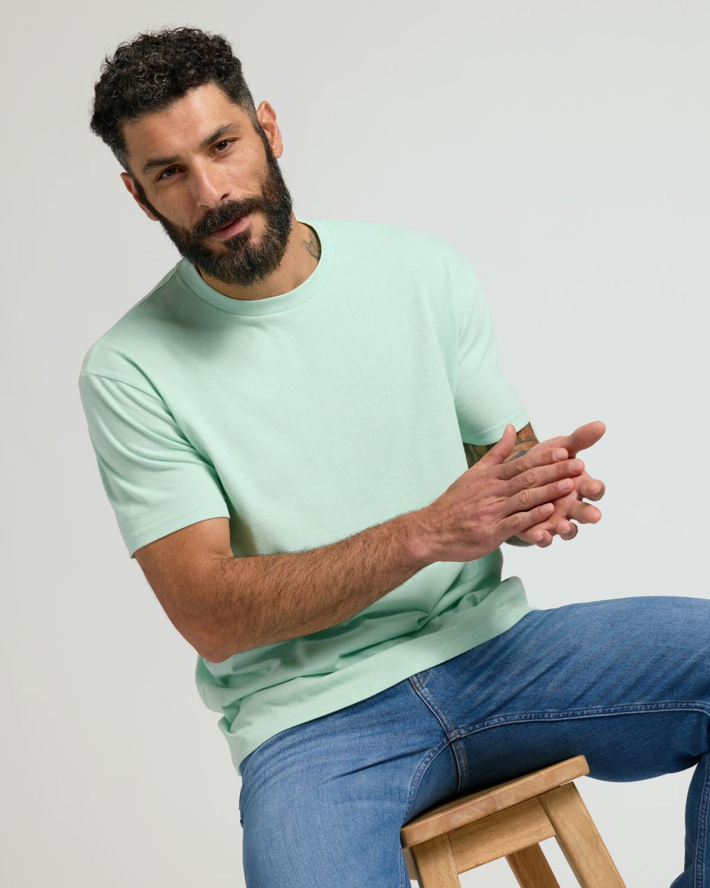 Heather Mist Classic Crew Neck on man, showcasing fit and minimalist style.