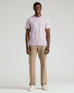 True ClassicMan wearing a light purple t-shirt and beige pants on a white background