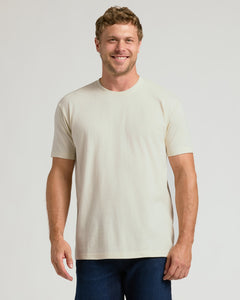 True ClassicMan wearing a plain beige t-shirt against a light gray background