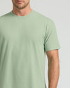 Man wearing a light green t-shirt against a plain background