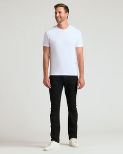 True ClassicWhite short-sleeve crew neck t-shirt on a male model with black pants and white shoes.