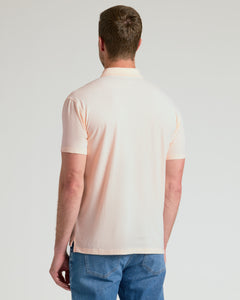 True ClassicBack view of man in Coral Blush Classic Polo and jeans.