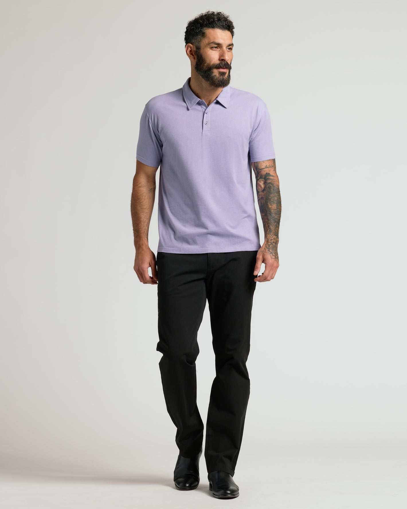 Male model in Heather Dark Orchid Short Sleeve Polo.