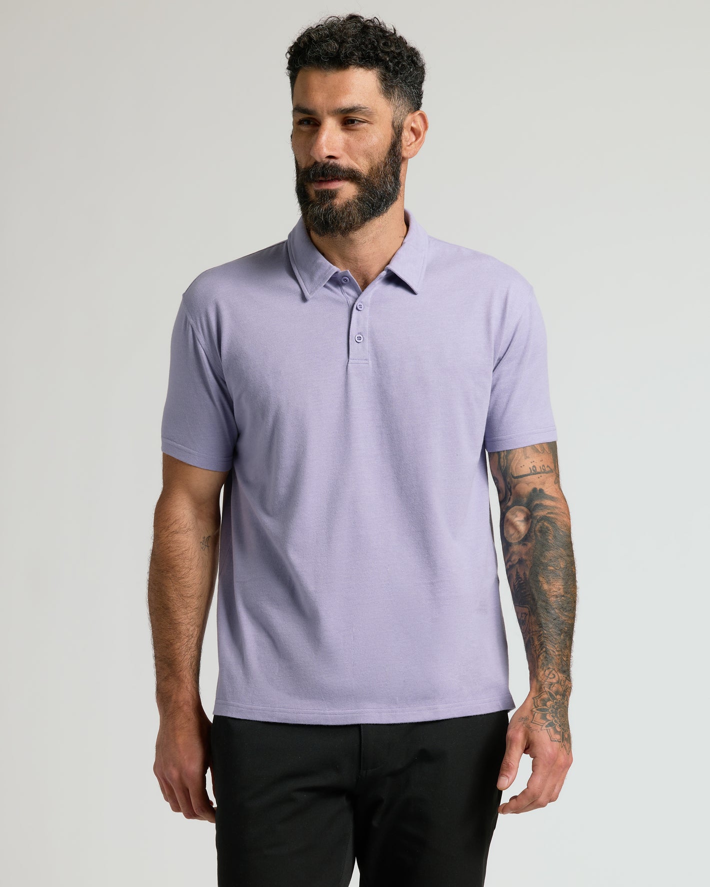 Heather Dark Orchid Short Sleeve Polo worn by a bearded man.