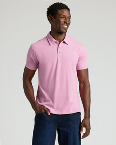 True ClassicModel wearing Heather Mauve Classic Polo with dark jeans, smiling.