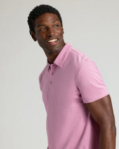 True ClassicMan wearing Heather Mauve Classic Polo, smiling and looking left.