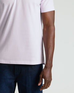 True ClassicHeather Orchid Classic Polo worn with dark jeans, highlighting its fitted design.