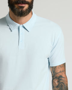 True ClassicMan wearing Icicle Classic Polo with tattooed forearm.