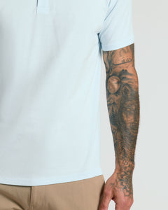 True ClassicIcicle Classic Polo with tattooed arm detail.